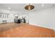 Open-concept living area with hardwood floors and modern lighting, perfect for entertaining and relaxation at 9520 Rancho Palmas Dr, Las Vegas, NV 89117