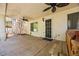 Outdoor patio with ceiling fans, outdoor access door, and a hot tub at 9520 Rancho Palmas Dr, Las Vegas, NV 89117