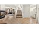 Inviting entryway with tile floors, stairs, and a glimpse of the living room and fireplace at 9522 Arrowhead Falls Ct, Las Vegas, NV 89148