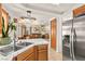 Bright kitchen with stainless steel appliances and an open layout leading to the living area at 9522 Arrowhead Falls Ct, Las Vegas, NV 89148