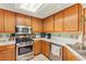 Well-maintained kitchen with stainless steel appliances and ample cabinet space at 9522 Arrowhead Falls Ct, Las Vegas, NV 89148