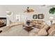 Inviting living room featuring a fireplace, plush sofas, and an open layout at 9522 Arrowhead Falls Ct, Las Vegas, NV 89148