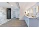 Spacious bathroom with dual sink vanity, marble counters, walk-in shower, and modern fixtures creates a spa-like experience at 9541 Summersweet Ct, Las Vegas, NV 89123