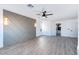 Large bedroom with a fan and statement wall with geometric design and modern light fixtures at 9541 Summersweet Ct, Las Vegas, NV 89123