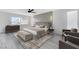 Serene bedroom features a decorative accent wall, neutral color scheme, and large windows for natural light at 9541 Summersweet Ct, Las Vegas, NV 89123