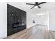 Living room featuring new floors, modern fireplace, and bright lighting at 9541 Summersweet Ct, Las Vegas, NV 89123
