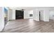 Open living area with recessed lighting, sliding glass doors, and modern fireplace at 9541 Summersweet Ct, Las Vegas, NV 89123