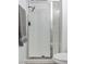 Modern bathroom features a shower with frameless glass door and black shower head at 9541 Summersweet Ct, Las Vegas, NV 89123