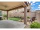 View of a patio area, artificial turf, and a cozy fire pit for outdoor relaxation at 9557 Belmont Bay Ave, Las Vegas, NV 89148