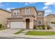 Inviting two-story home featuring a neutral color scheme, attached garage, and well-manicured landscaping at 9557 Belmont Bay Ave, Las Vegas, NV 89148