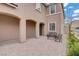 Spacious front porch featuring an seating area and an arched entryway at 9557 Belmont Bay Ave, Las Vegas, NV 89148
