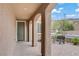 Welcoming front porch with a bench, decorative columns, and a well-maintained paved area at 9557 Belmont Bay Ave, Las Vegas, NV 89148