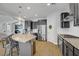 Spacious kitchen features granite counters, stainless appliances, and island with breakfast bar seating at 9557 Belmont Bay Ave, Las Vegas, NV 89148