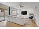 Relaxing living room featuring a TV, plush seating, and natural light at 9557 Belmont Bay Ave, Las Vegas, NV 89148