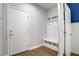 Well-organized mud room featuring storage, hooks, and a convenient bench at 9557 Belmont Bay Ave, Las Vegas, NV 89148