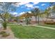 Community playground with shaded picnic benches and play equipment on a well-maintained lawn at 9557 Belmont Bay Ave, Las Vegas, NV 89148