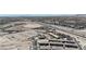 The photo shows a wide view of new residential development, set against the backdrop of the I-15 Freeway at 9605 Oliver Hills Ave, Las Vegas, NV 89143