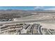 An aerial captures new homes with a mountain backdrop, near the I-11, situated in a growing community with ample space at 9605 Oliver Hills Ave, Las Vegas, NV 89143