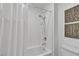 Bright bathroom featuring a tub with white subway tile surround and decorative wall art at 9605 Oliver Hills Ave, Las Vegas, NV 89143