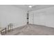 Clean, minimalist bedroom features neutral carpet, closet, and a ceiling fan at 9605 Oliver Hills Ave, Las Vegas, NV 89143