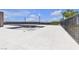 Unfinished community pool with spacious patio area, perfect for relaxing and soaking up the sun at 9605 Oliver Hills Ave, Las Vegas, NV 89143