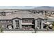 Townhome exterior featuring a private patio, modern architecture, and well-maintained landscaping at 9605 Oliver Hills Ave, Las Vegas, NV 89143