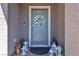 Welcoming front door adorned with a floral wreath and decorative lanterns at 9605 Oliver Hills Ave, Las Vegas, NV 89143