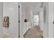 Bright hallway with storage and art at 9605 Oliver Hills Ave, Las Vegas, NV 89143