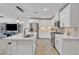 Bright modern kitchen featuring white cabinets, stainless appliances, and quartz countertops at 9605 Oliver Hills Ave, Las Vegas, NV 89143