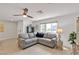 Spacious living room featuring a comfortable sectional sofa and neutral decor at 9605 Oliver Hills Ave, Las Vegas, NV 89143