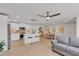 Bright living space featuring tile floors, white cabinets, stainless appliances, and a dining area at 9605 Oliver Hills Ave, Las Vegas, NV 89143