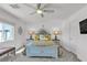Cozy main bedroom with ceiling fan and bright, natural light at 9605 Oliver Hills Ave, Las Vegas, NV 89143