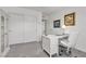Bright office features neutral carpet, white desk, and a large closet at 9605 Oliver Hills Ave, Las Vegas, NV 89143