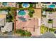 Aerial view of a luxurious property with a pool, solar panels, and ample space, defined by a clear property line at 9749 Glistening Brook Ct, Las Vegas, NV 89149