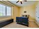 Cozy bedroom with a sports theme, window, and neutral color scheme at 9749 Glistening Brook Ct, Las Vegas, NV 89149