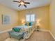 Charming bedroom featuring a comfortable bed, plush seating and bright decor at 9749 Glistening Brook Ct, Las Vegas, NV 89149
