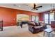 Spacious game room featuring a foosball table, comfortable seating, and access to an outdoor balcony at 9749 Glistening Brook Ct, Las Vegas, NV 89149