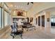 Expansive living room with high ceilings, a large window, and an open floor plan at 9749 Glistening Brook Ct, Las Vegas, NV 89149
