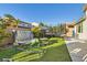 Spacious backyard featuring a waterfall feature, trampoline, and outdoor seating area at 9765 Skye Star Ave, Las Vegas, NV 89166