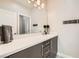 Modern bathroom with a large mirror, sleek vanity, and stylish towel hooks at 9765 Skye Star Ave, Las Vegas, NV 89166