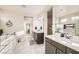Contemporary bathroom showcasing dual vanities, a soaking tub, and a walk-in shower at 9765 Skye Star Ave, Las Vegas, NV 89166