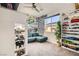 Charming bedroom featuring playful decor, shelves of toys, and a cozy seating area at 9765 Skye Star Ave, Las Vegas, NV 89166