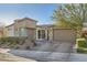 Attractive home featuring a two-car garage, stone accents, and a paved driveway at 9765 Skye Star Ave, Las Vegas, NV 89166
