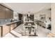 Bright kitchen with updated appliances, a spacious island, and an adjacent dining area, perfect for Gathering meals at 9765 Skye Star Ave, Las Vegas, NV 89166