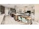Open-concept kitchen with an island and a table that seats four, great for both cooking and casual dining at 9765 Skye Star Ave, Las Vegas, NV 89166