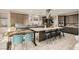 Modern kitchen featuring a large island with seating, stainless steel appliances, and stylish countertops at 9765 Skye Star Ave, Las Vegas, NV 89166