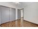 Bedroom features hardwood floors, closet with sliding doors, and neutral walls at 10078 Delicate Dew St, Las Vegas, NV 89183