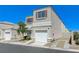 Inviting two-story home featuring a one car garage and xeriscaped front yard at 10078 Delicate Dew St, Las Vegas, NV 89183