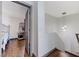 Hallway with hardwood floors, access to bedroom, and stylish pendant lighting at 10078 Delicate Dew St, Las Vegas, NV 89183