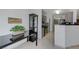 Efficient kitchen with gray cabinets, black countertops, and modern appliances for easy meal preparation at 10078 Delicate Dew St, Las Vegas, NV 89183